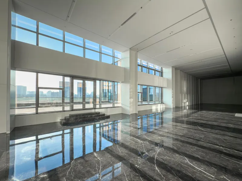 Premium commercial epoxy floor in a modern lobby with city view