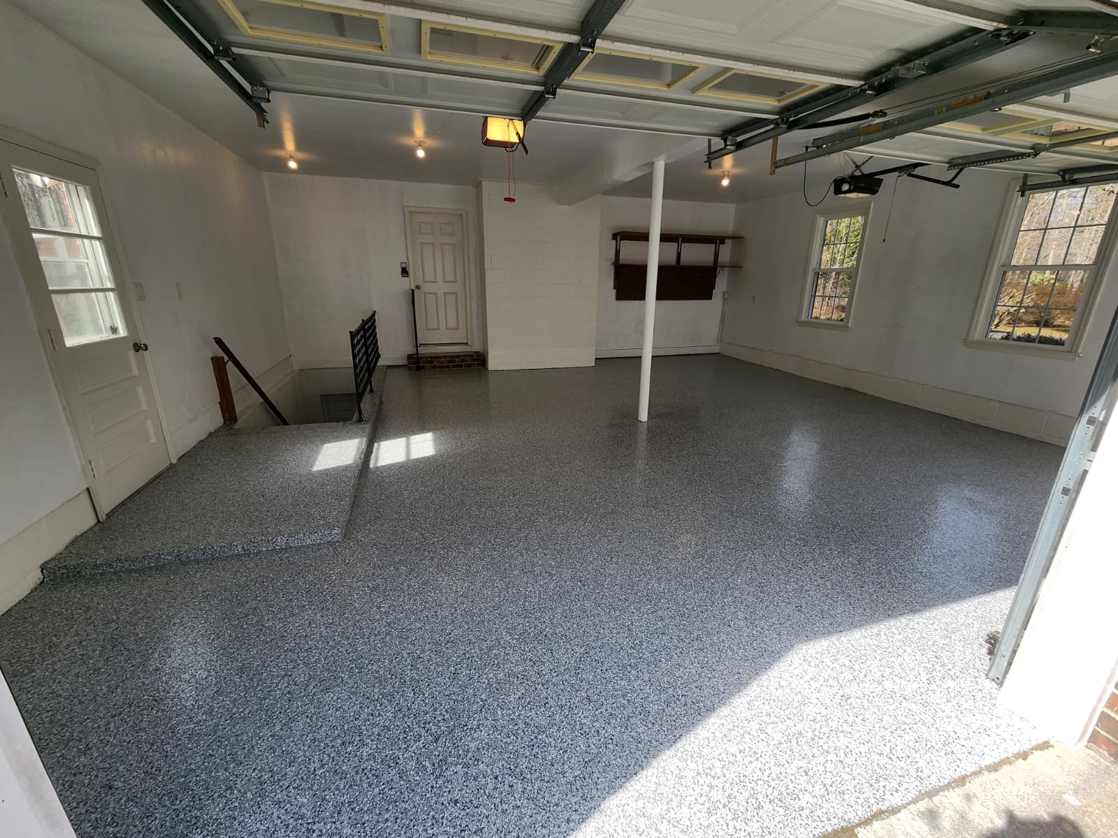 Garage floor after epoxy coating with clean smooth and durable finish